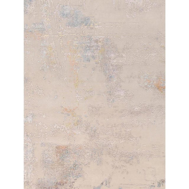 The Modern Collection explores hand-knotted designs through abstract patterning, solid tonal fields, and subtle surface...