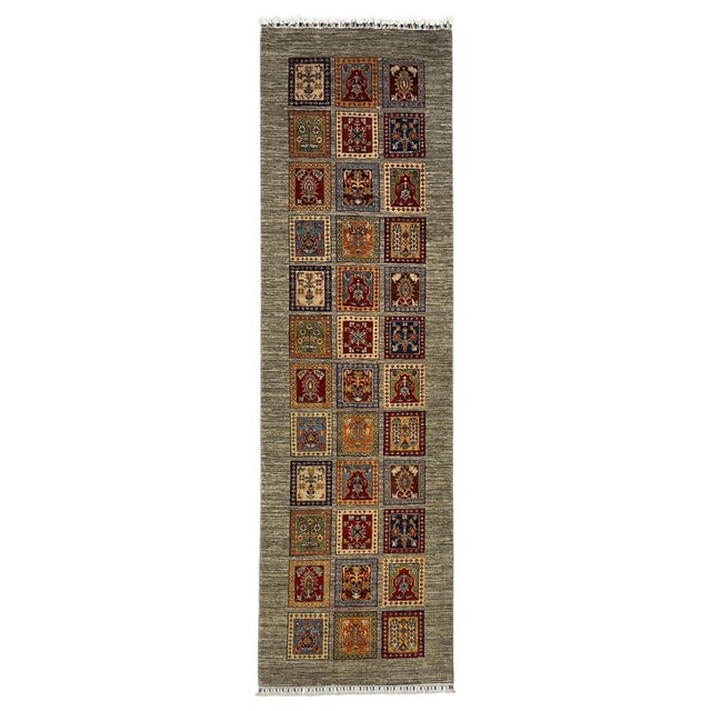 This Afghan Sultani natural-dye wool runner features a Persian Bakhtiari Four Seasons-inspired design. Rows of framed...