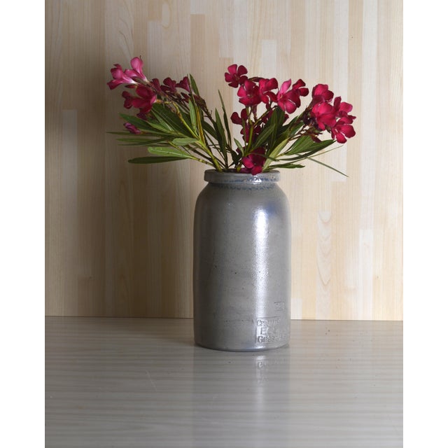 This antique terracotta vase with a patinated finish embodies the traditional craftsmanship of southern France from the...