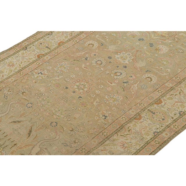 This vintage 6x10 rug is believed to be a Hereke rug, hand-knotted in wool from Turkey circa 1950-1960. Hereke rugs...