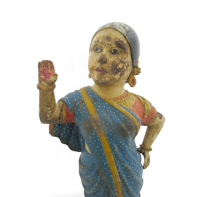 Large hand carved and hand painted wood Hindu Indian statue. Indian woman in traditional garb with her hair pulled back...