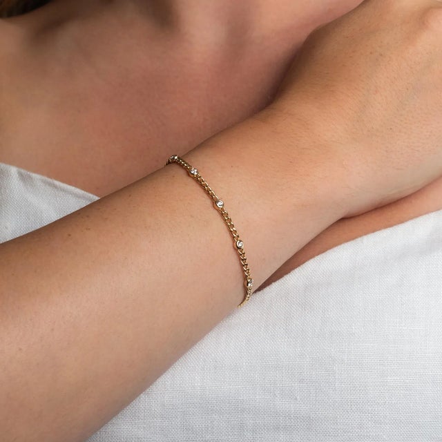 This is part of Chairish’s Fine Jewelry assortment. We love a cuban link chain to differentiate a bracelet stack. This one...