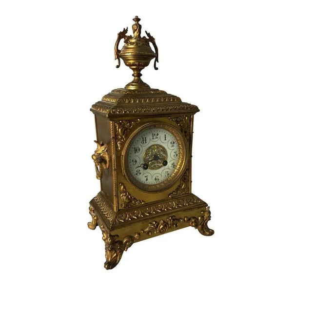 A fine quality french ormolu mantel clock, 19th century, in sevres manner. The ornate case with finely cast detailed...