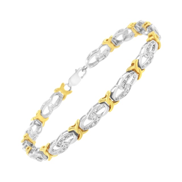 This stunning yellow gold and sterling silver link bracelet is certain to become a favorite. Polished yellow gold X shaped...
