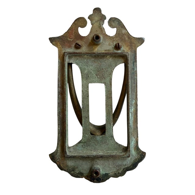 The perfect door knocker for any style home. Original bronze patina with a slight verdigris that is a true sign of...