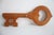 Wall hanger in the shape of a key, carved from wood Can be used as a key hanger or other small item with aged patina...