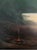 A very dreamy landscape with a smoldering fire and a pair of canoes. 24ʺW X 32ʺH