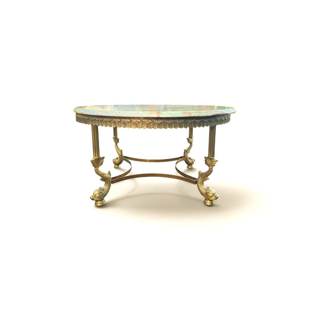 Elegant and stylish Round Mid Century French Brass coffee table with green onyx marble top and Koi Fish legs. Ornate round...