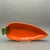 This charming vintage ceramic serving dish is shaped like a bright orange carrot with a textured brown exterior. It is...