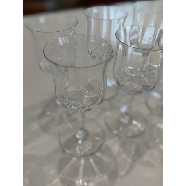 A stunning and rare set of nine (9) Baccarat crystal water goblets in the graceful Capri Optic pattern. These 6" stems...