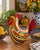 Striking hand-blown art glass rooster by Lenox, featuring a bold, sculptural form and vibrant multicolor striped...