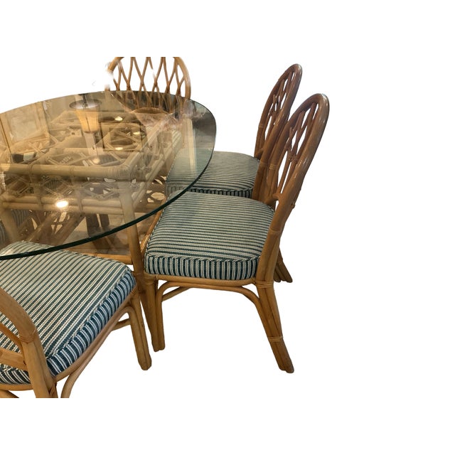 ​Wonderful vintage, Mid Century Modern, rattan and bamboo dining room set including glass table top and 6 chairs. The...