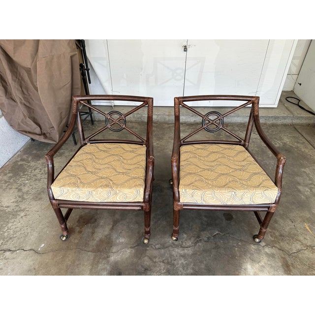 A beautiful pair of McGuire Target Back lounge chairs on casters. Purchased new in 2000. Two pairs and a single are...