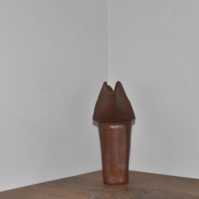 Studio ceramic winged vase vessel sculpture in burnt rust tone glaze.