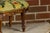 A French Louis XV style carved walnut footstool from the 19th century with tapestry upholstery. This French Louis XV-style...