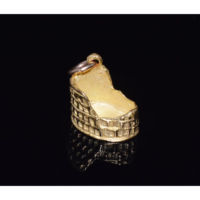 This detailed Colosseum charm is crafted in solid 18K yellow gold and designed as a three-dimensional miniature of the...