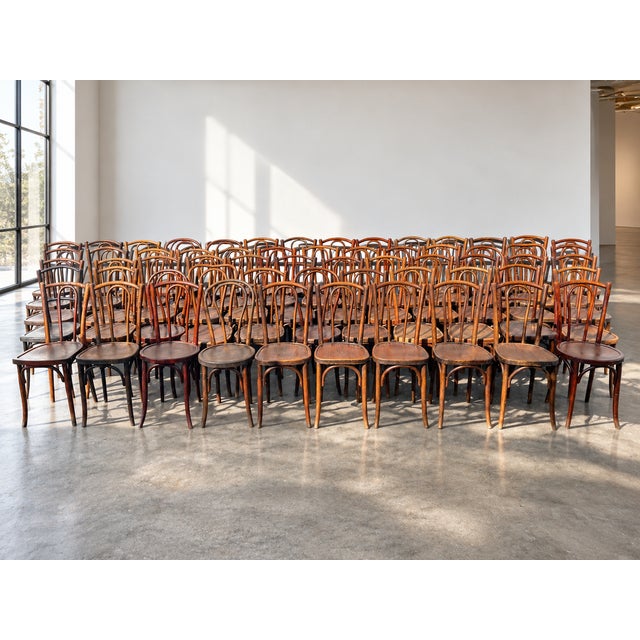 Rare set of 60 bistro chairs, circa 1940-1960, original "pin" model, made of solid wood, with historical provenance from a...