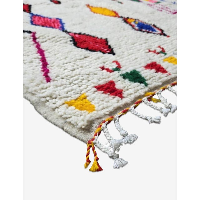 Handmade Moroccan Diamond Rug – Colorful Berber Wool Carpet This handmade Moroccan diamond rug is a vibrant celebration of...
