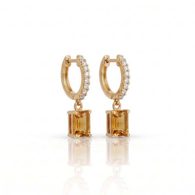 Elevate your daily ensemble with these breathtaking drop huggie hoop earrings featuring a sparkling pavé-set hoop and a...
