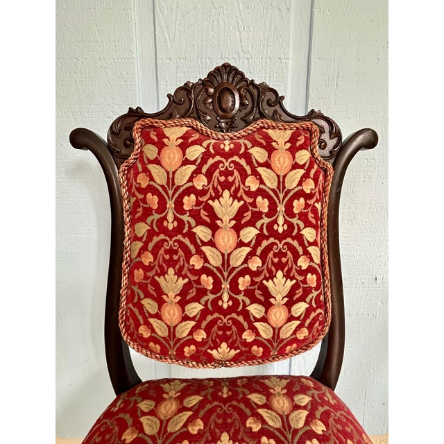 A superb American Victorian Rococo Revival mahogany parlor chair dating to approximately 1860–1885. This is a genuine...