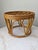 A vintage rattan ottoman, in the manner of Paul Frankl.
