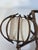 Wall sconce by French designer Louis Sognot, emblematic of the organic modernism of the 1950s. A curved rattan structure...