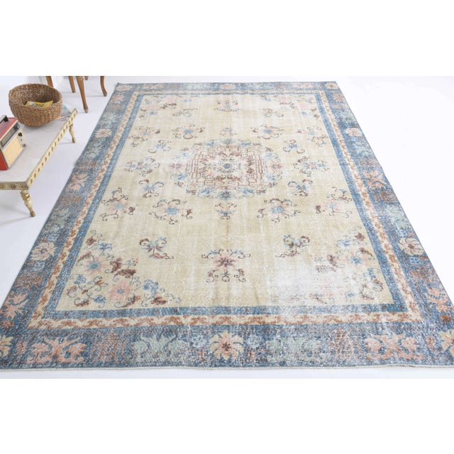 Vintage Turkish Hand-Knotted vintage rug is a semi-antique vintage area rug.'70s Eastern region of Turkey's unique rug is...