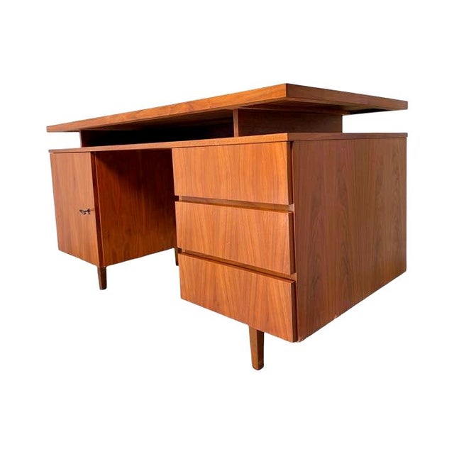 A cubical desk from the 1960s, crafted entirely from teak veneer. Its clean, minimalist lines and functional design...