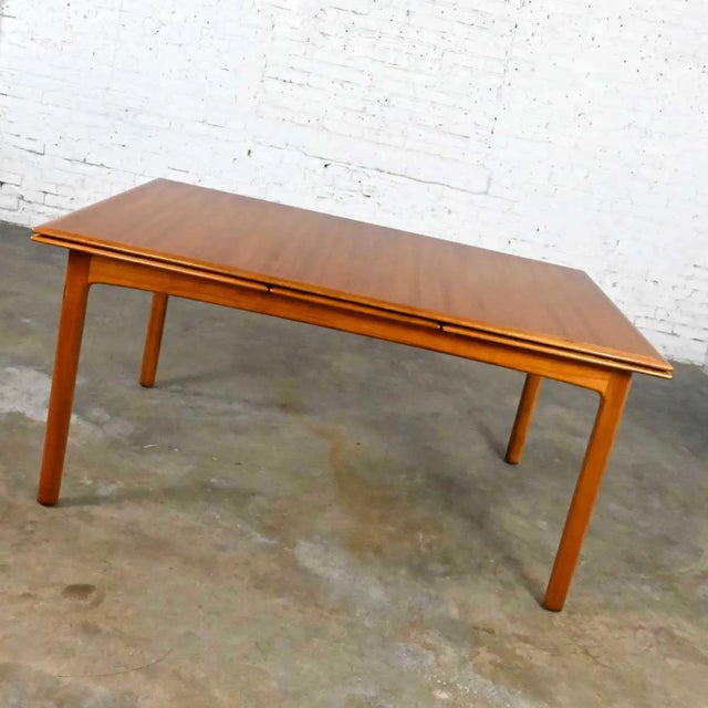 Handsome vintage Scandinavian Modern teak draw leaf extending dining table by Folke Ohlsson for DUX. Beautiful condition,...