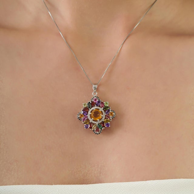This Regent Starburst Multi-Gemstone Pendant features a vibrant arrangement of marquise and round-cut gemstones set in 925...
