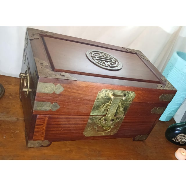 Gorgeous Rosewood and brass jewelry box with two velvet lined drawers. Beautiful vintage condition. Made in Hong Kong in...