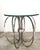 This eye-catching piece is a vintage Mid-Century Modern "Spider" or loop-ring table featuring a sculptural chrome base and...
