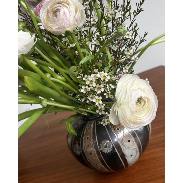 Ceramic vase with a delicate floral relief and glazed finish. Produced by the west german pottery workshop töpferhof...