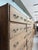This large antique workshop cabinet, dating from the first half of the 20th century, impresses with its dimensions and its...