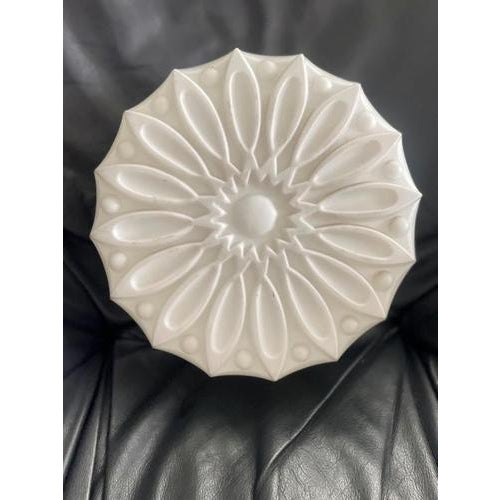 This sculptural ceiling light shade was produced in Czechoslovakia during the mid-20th century, most likely between the...