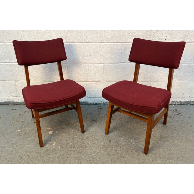 Vintage Gunlocke Model 23-C dining chairs, expertly crafted from rich walnut and showcasing the timeless simplicity of...