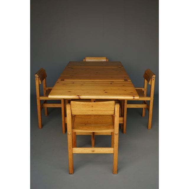 A set of four dining chairs with extendable dining table. This is a solid and well-made set. The table has two large drop...
