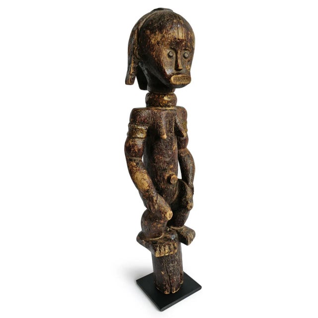Beautiful Fang female reliquary guardian figure. Positioned on a post for carrying and now mounted on a removable iron...