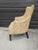 A stunning and well-made antique high barrel back bergère armchair in original period fabric in the Hollywood Regency...