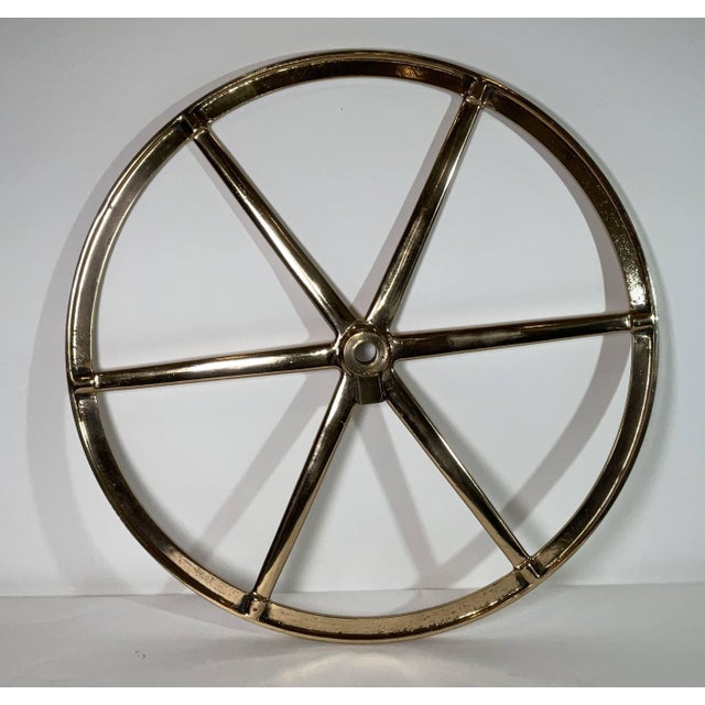 Solid brass ships wheel that has been highly polished and lacquered. Six spoke wheel with gear from a yacht. 38"Dia 60 lbs.