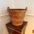 Mid Century large reed and twig round basket with twisted handles. Measures 19” diameter at top, 12” diameter at bottom x...