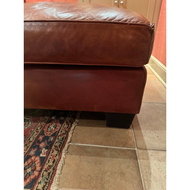 Handsome Ralph Lauren sofa in a thick and buttery cognac saddle leather. Beautifully designed with a low profile wooden...