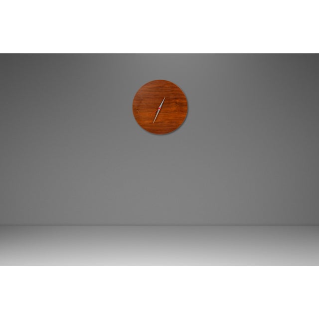 Introducing an alluring minimalist wall clock carved from solid black walnut and featuring stunning variegated woodgrains....