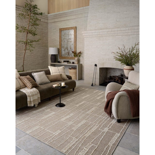 The Bexley Collection is a modern area rug with a loosely structured, organic design from Amber Lewis x Loloi. The rug...
