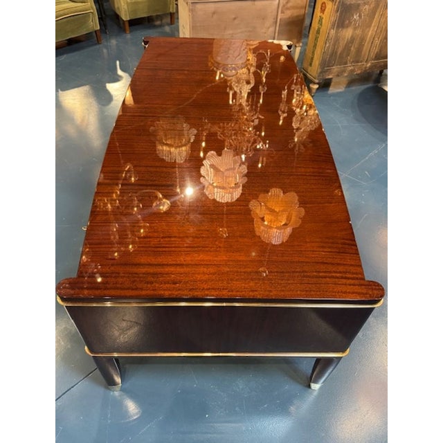 The recently restored Decoene Freres Art Deco Style Mahogany Desk is a luxurious and elegant addition to any home office...
