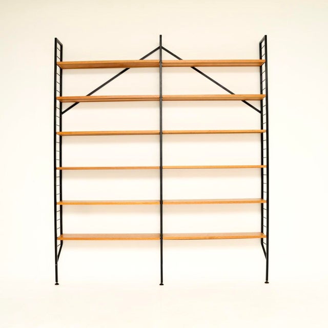 A very stylish and practical vintage teak ladderax bookcase shelving unit. This was made in England, it dates from the...