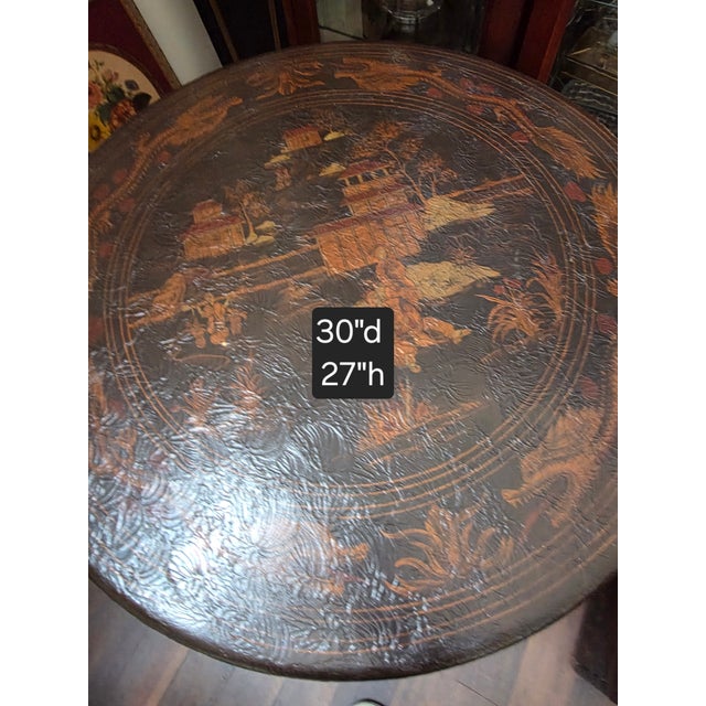 Black Chinoiserie end table or small center table in the style of a Chinese Export table. The surface is intentionally...