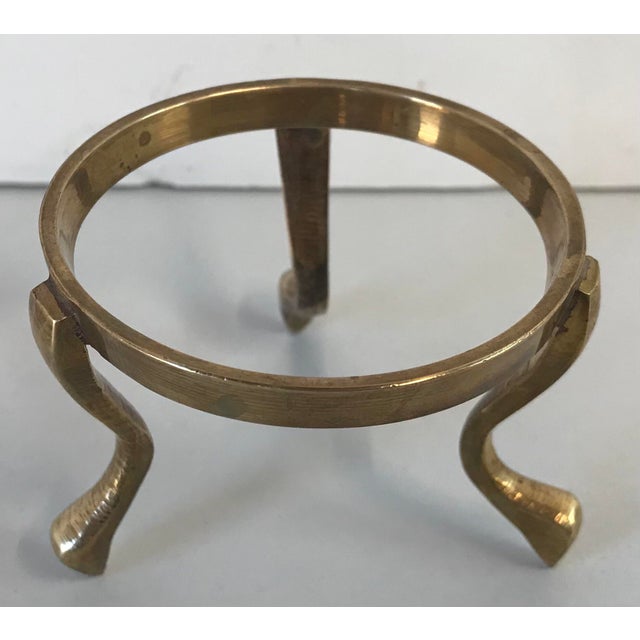 Nice vintage brass stand with hoof feet for showcasing a sphere or vase. I have three available.