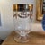 Hand blown large can holder. Elegant gold work along the rim. This Hurricane cancel vase is 13”tall x 7” wide at the...