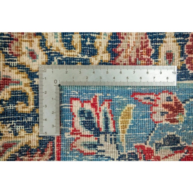Hand-knotted rug from the city of Isfahan. The rug is signed by tying the name into the kilim part near the fringe....